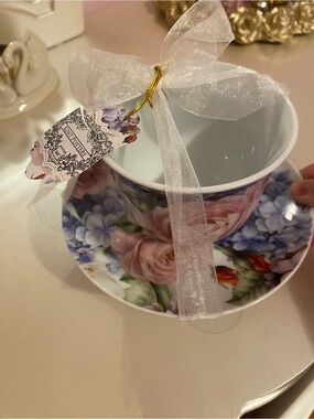 A collectible floral tea cup and saucer set by Kent Pottery.